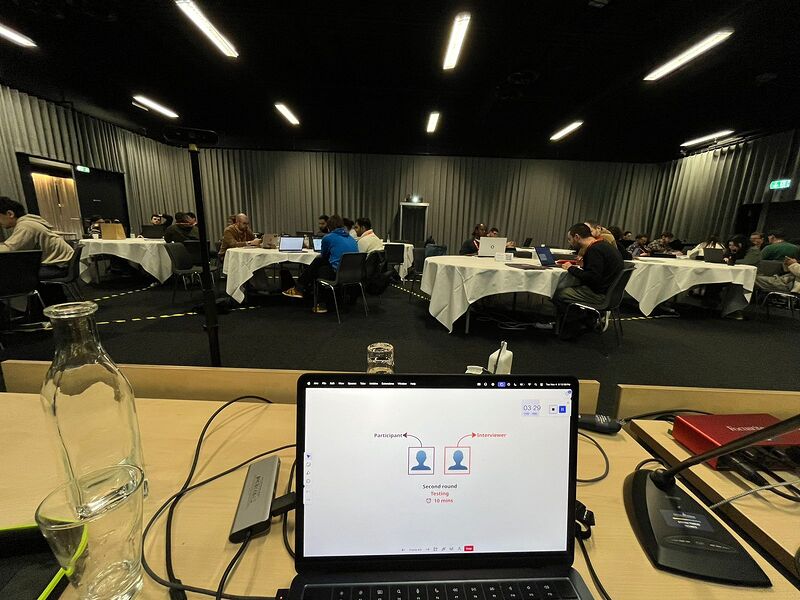 Teams running live research rounds during the workshop.